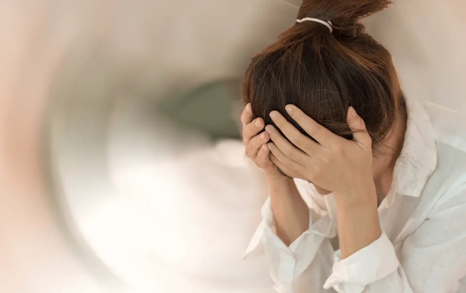 Woman holding her head
